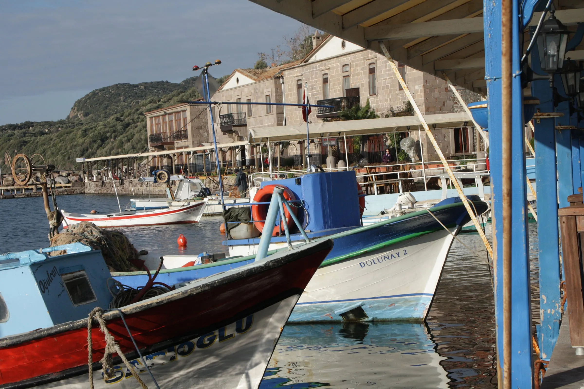 Fishing boats in the stone harbour of Assos