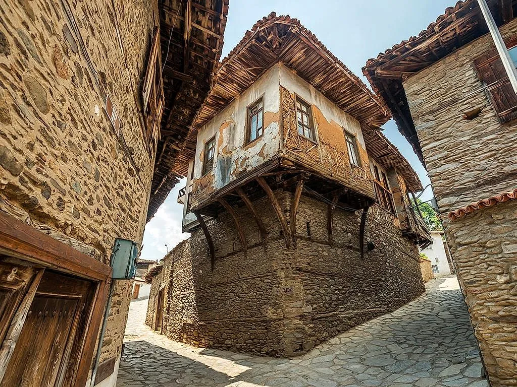 A timber-framed Ottoman house on a cobbled lane in Birgi