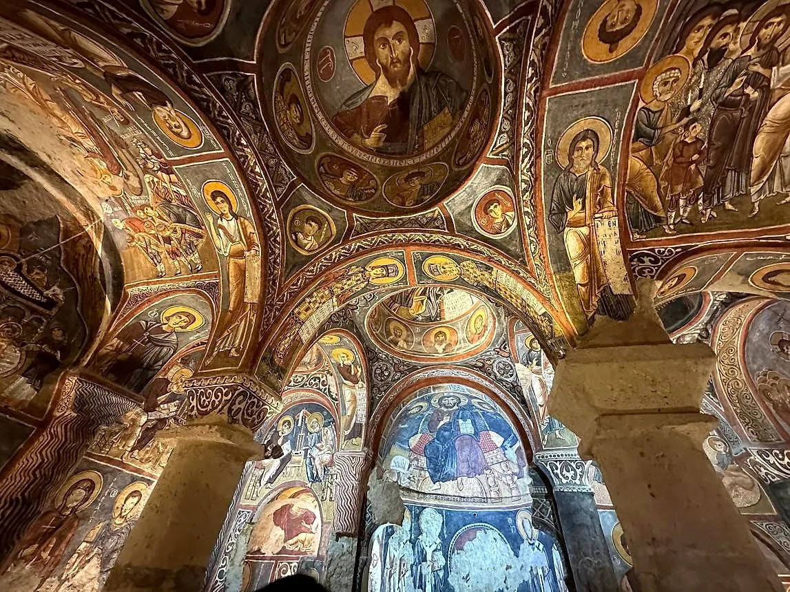Brightly coloured frescoes under the domes of the Dark Church