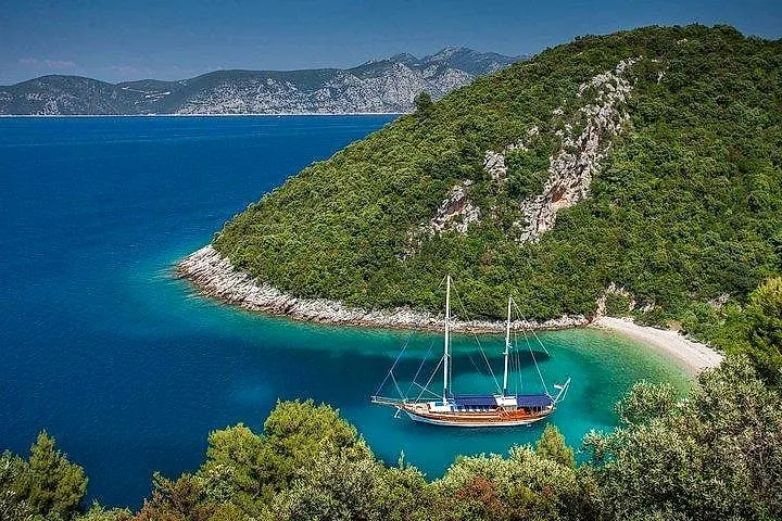 A gulet anchored in a quiet cove