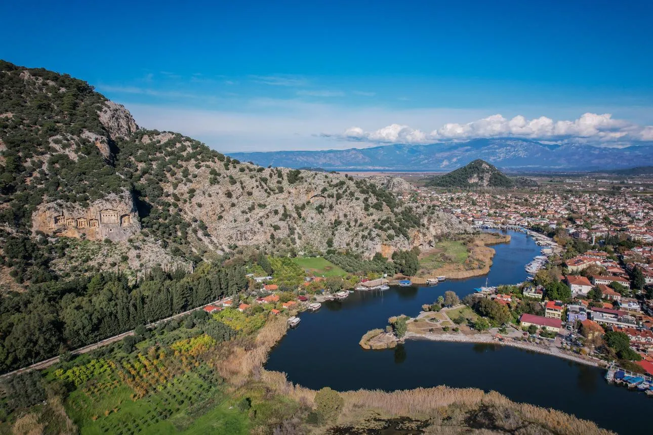 The river winding through Dalyan below the cliff of rock-cut tombs