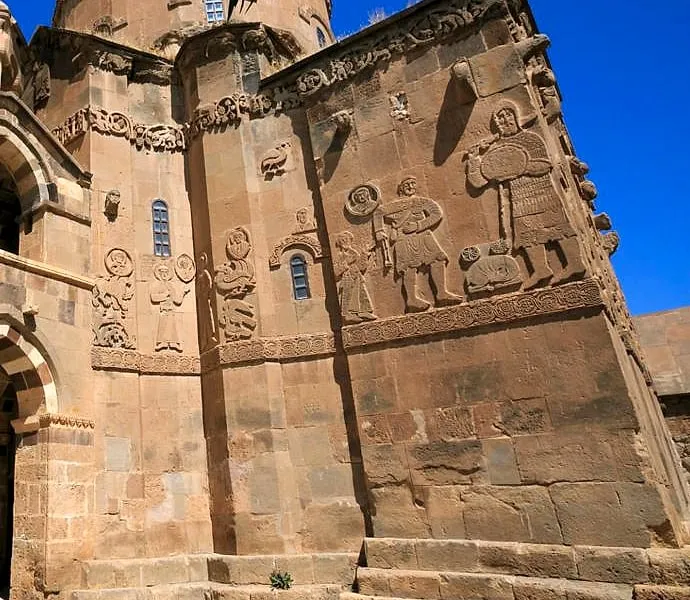Carved biblical figures on the walls of the Church of the Holy Cross