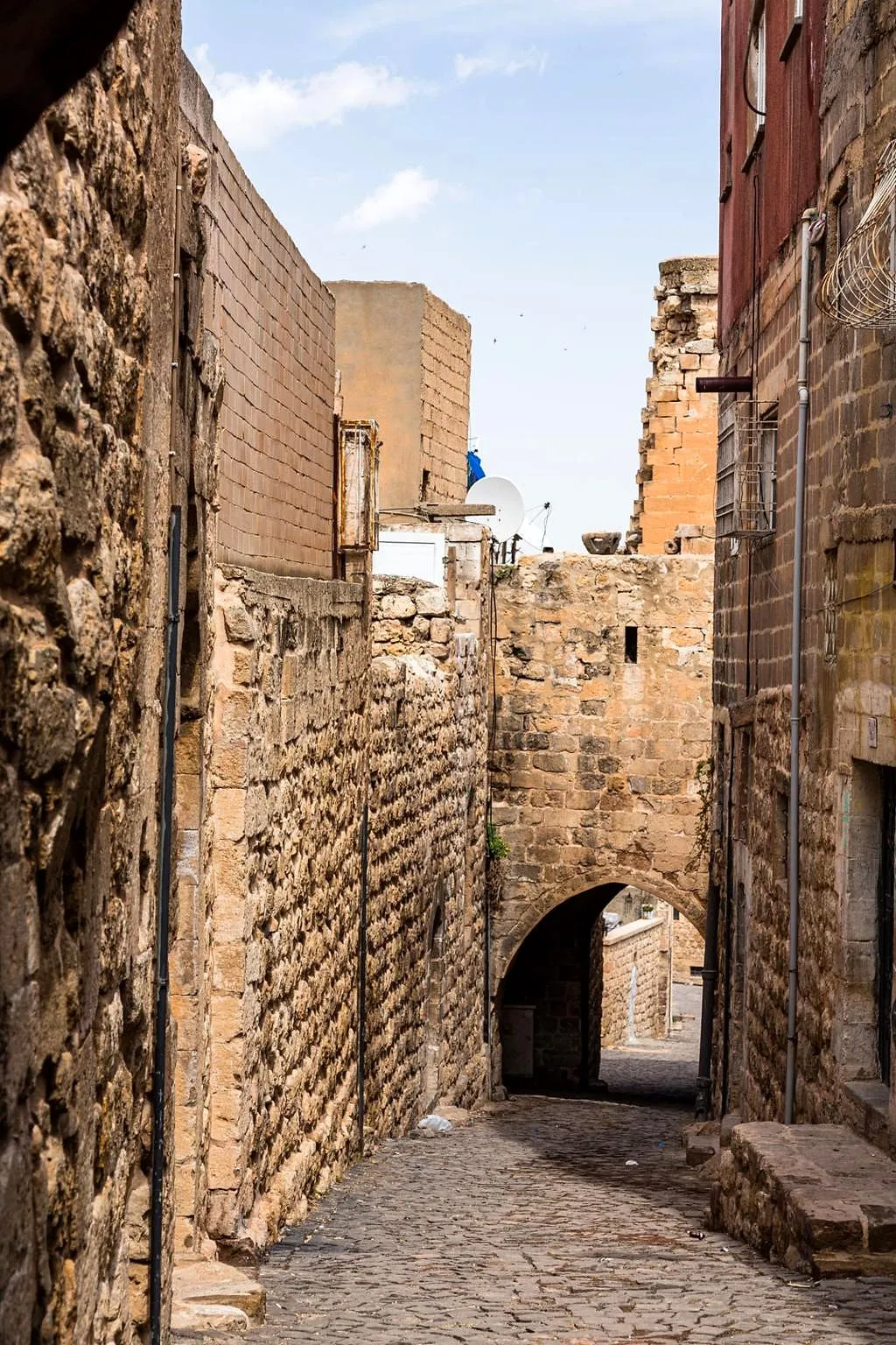A narrow vaulted stone lane in old Mardin