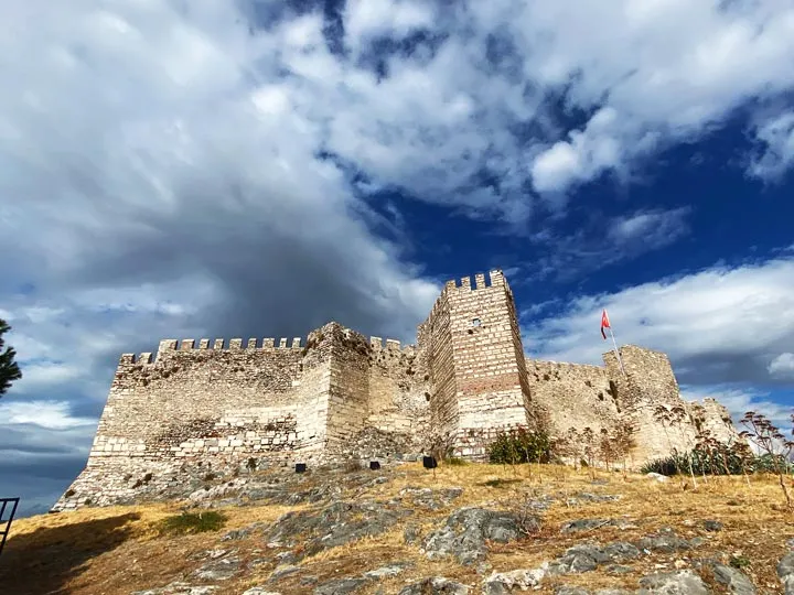 Walls of Ayasuluk Castle under a dramatic sky