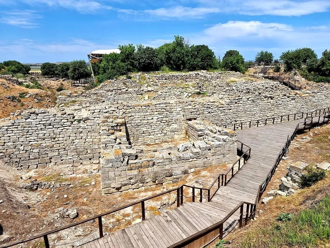 A wooden walkway past the ancient walls of Troy